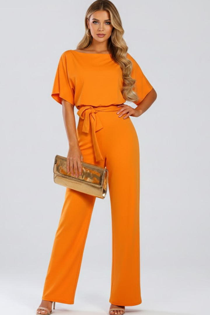 Women's black jumpsuit featuring short sleeves, a round neck, a stylish tie waist, and wide legs, perfect for casual or dressy occasions. 6