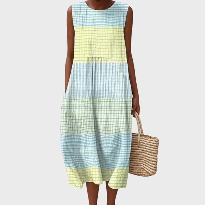 Women's linen midi dress featuring a relaxed fit and sleeveless design, showcasing a stylish blue and yellow check pattern. 0