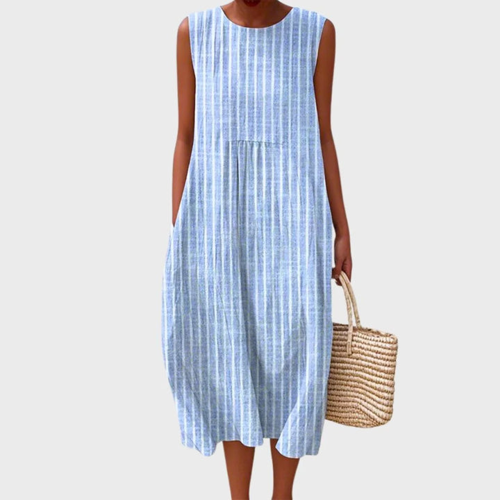 Women's linen midi dress featuring a relaxed fit and sleeveless design, showcasing a stylish blue and yellow check pattern. 3