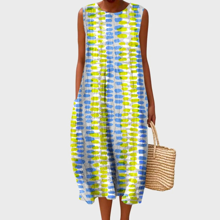 Women's linen midi dress featuring a relaxed fit and sleeveless design, showcasing a stylish blue and yellow check pattern. 4