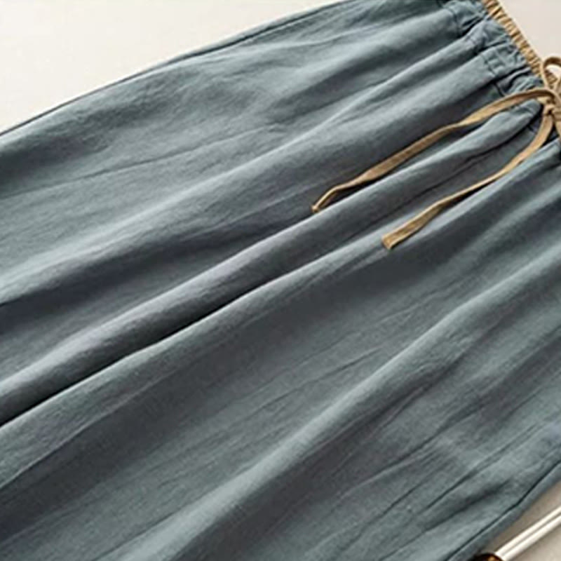 Women's linen pants featuring a comfortable drawstring and practical pockets, designed as casual long harem trousers for a relaxed and stylish look. 1