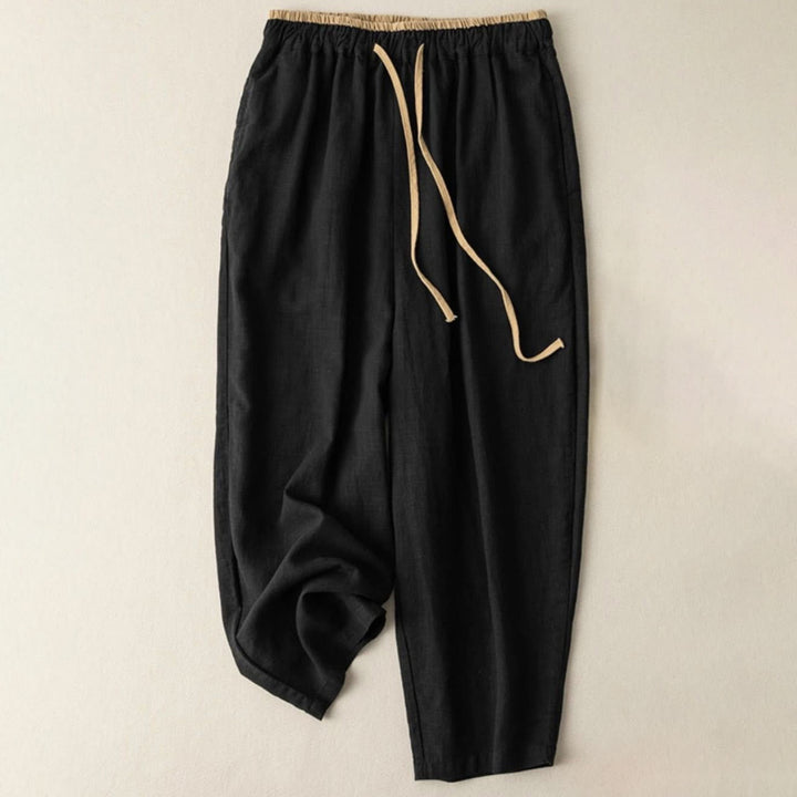 Women's linen pants featuring a comfortable drawstring and practical pockets, designed as casual long harem trousers for a relaxed and stylish look. 4