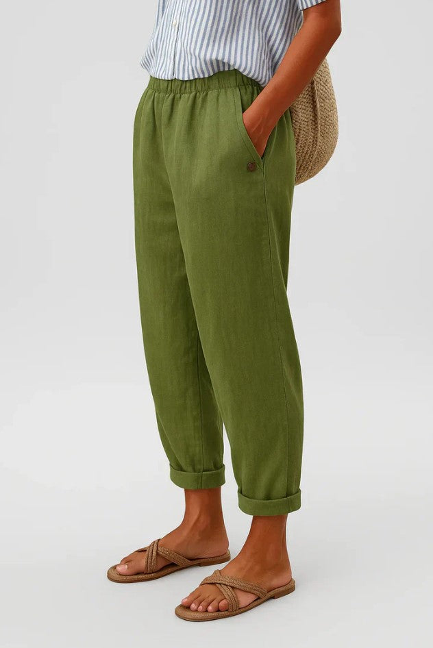 Women's breathable white linen pants featuring an elastic waistband and hidden pockets, perfect for summer wear. 3