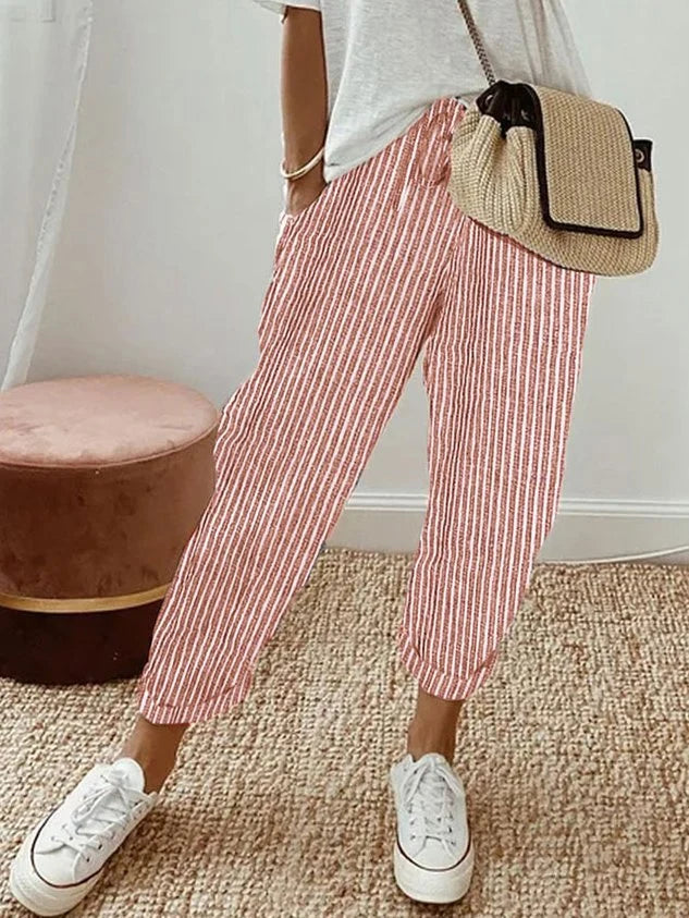 Women's breathable white linen pants featuring a relaxed fit, perfect for casual wear and warm weather styling. 6