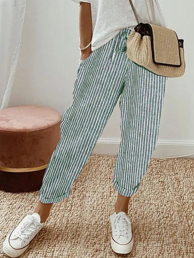 Women's breathable white linen pants featuring a relaxed fit, perfect for casual wear and warm weather styling. 9