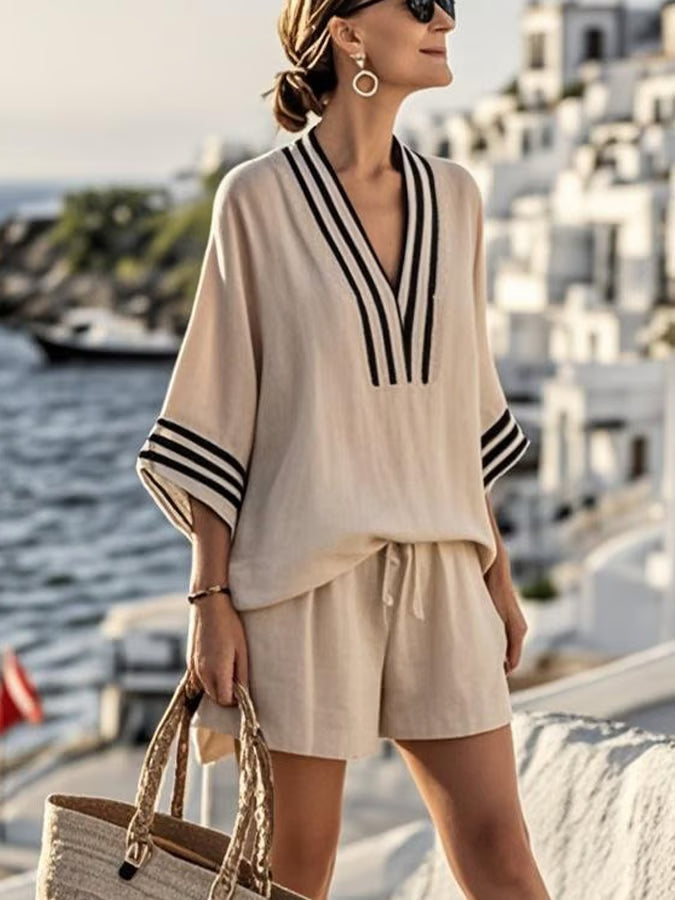 Women's lightweight linen-blend loungewear set featuring a striped V-neck top and relaxed shorts, perfect for comfortable lounging and casual outings. 0