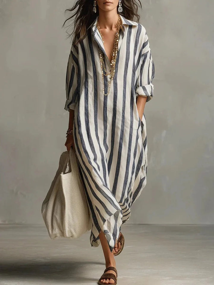 Women's striped linen maxi dress featuring adjustable roll-up sleeves, ankle-length design, and deep pockets for added convenience and style. 0