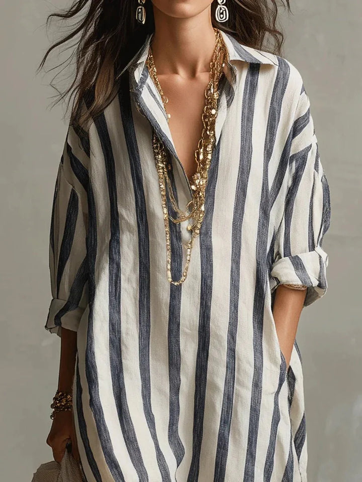 Women's striped linen maxi dress featuring adjustable roll-up sleeves, ankle-length design, and deep pockets for added convenience and style. 2