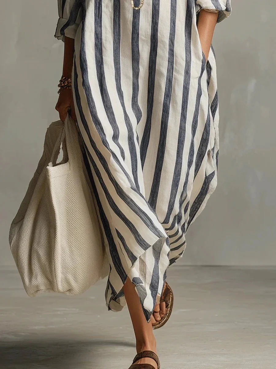 Women's striped linen maxi dress featuring adjustable roll-up sleeves, ankle-length design, and deep pockets for added convenience and style. 3