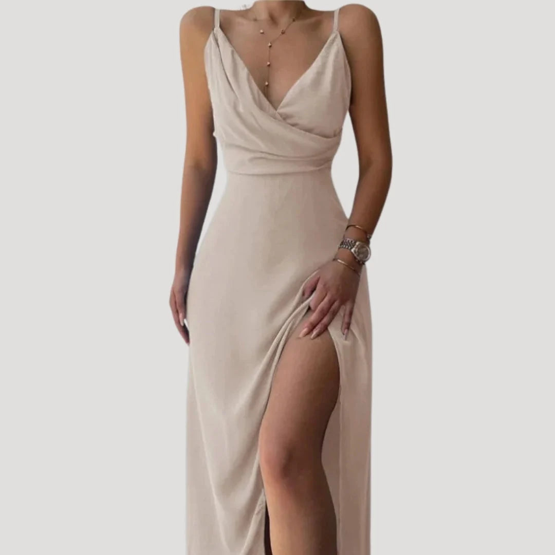 Women's maxi dress featuring an elegant slit, perfect for formal occasions, designed for a flattering long length and sophisticated style. 1