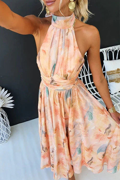 Elegant women's maxi dress featuring a stylish halter neckline and a beautiful floral pattern, perfect for summer occasions. 3
