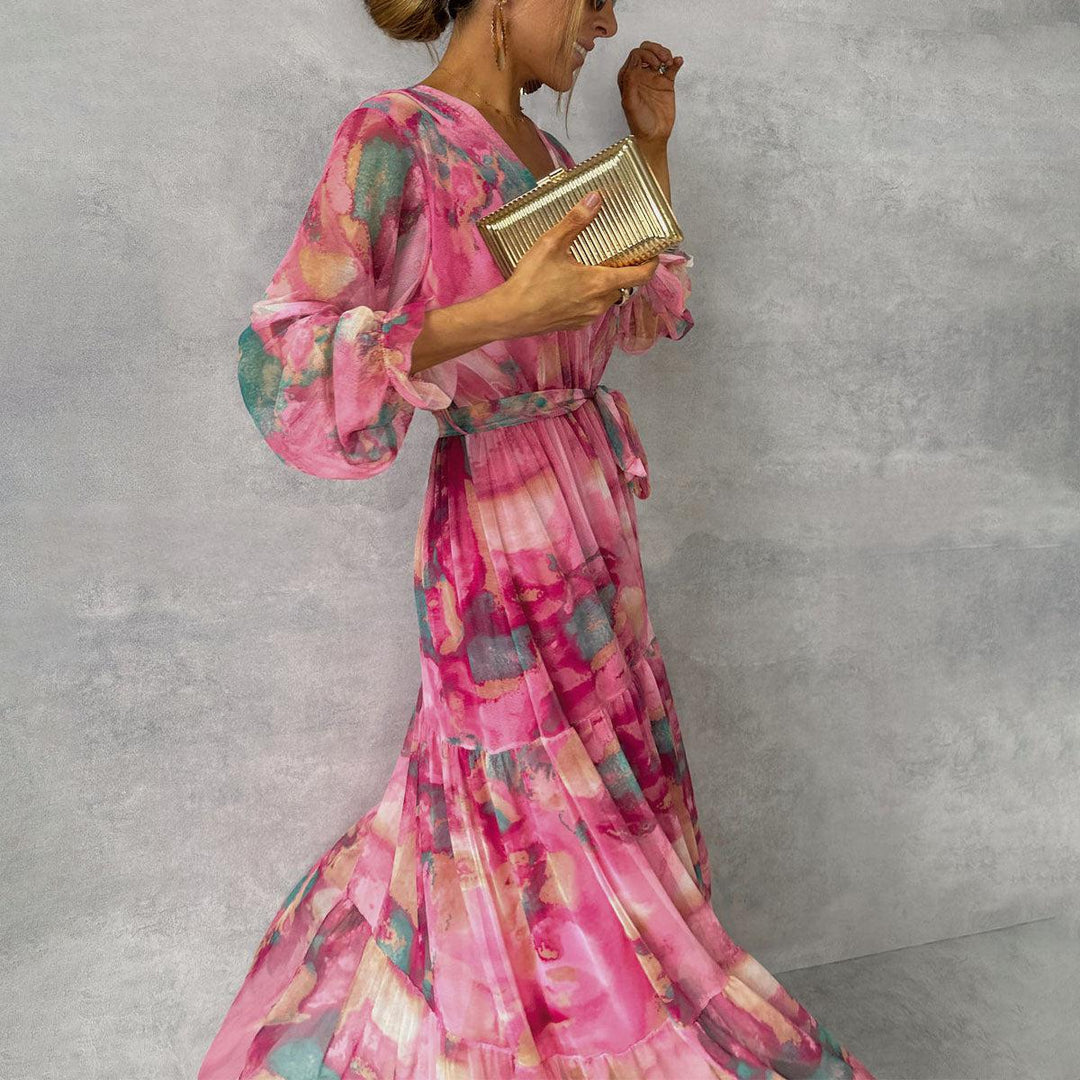 Women's maxi dress featuring a pleated design and floral pattern, elegantly belted, perfect for formal occasions and special events. 0