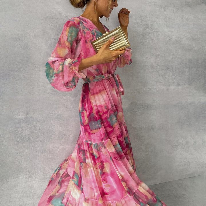 Women's maxi dress featuring a pleated design and floral pattern, elegantly belted, perfect for formal occasions and special events. 0