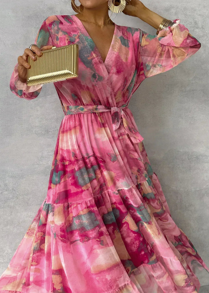 Women's maxi dress featuring a pleated design and floral pattern, elegantly belted, perfect for formal occasions and special events. 3