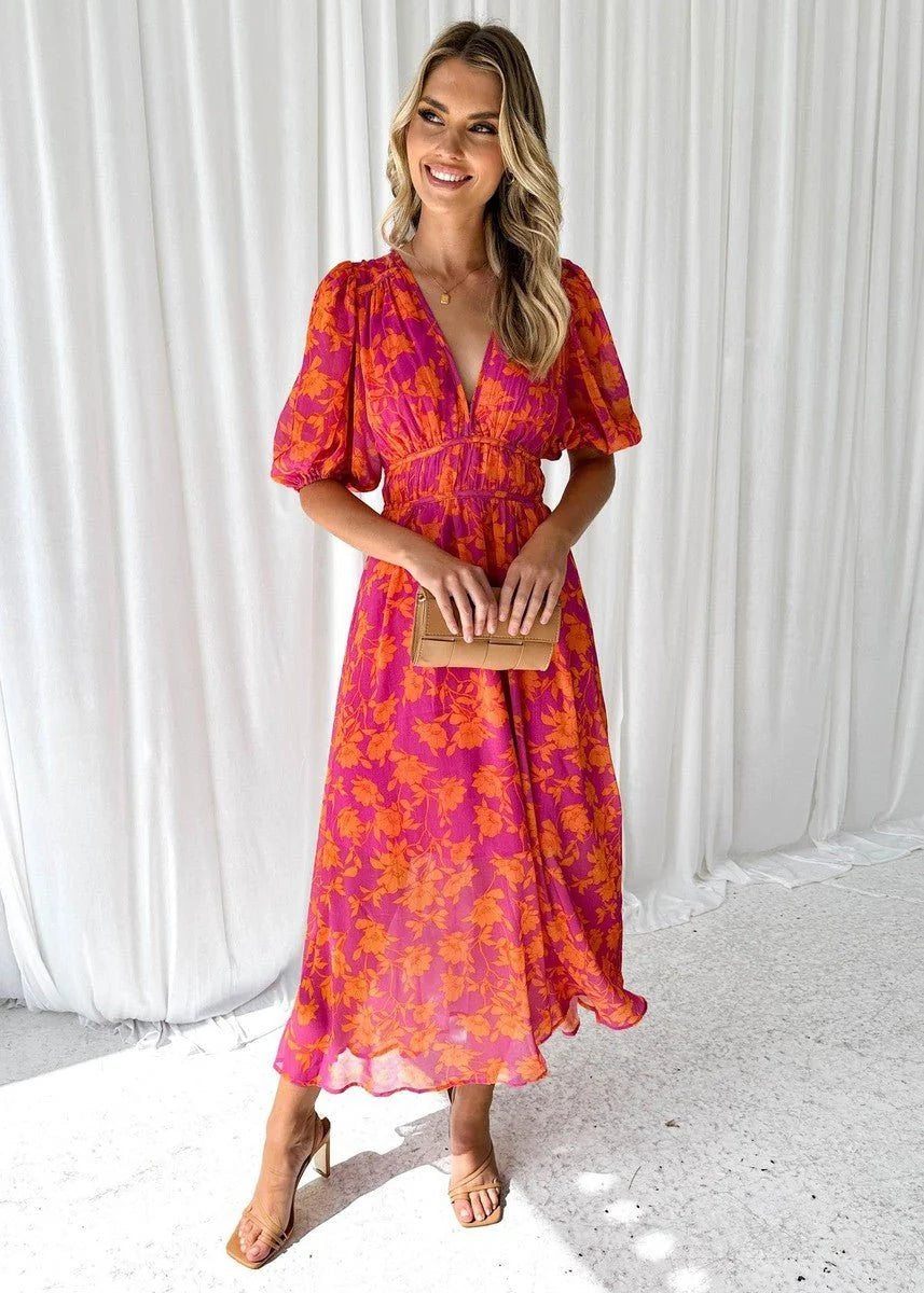 Women's midi dress featuring puff sleeves and a stylish V-neck, adorned with a vibrant floral print, perfect for autumn and winter occasions. 0