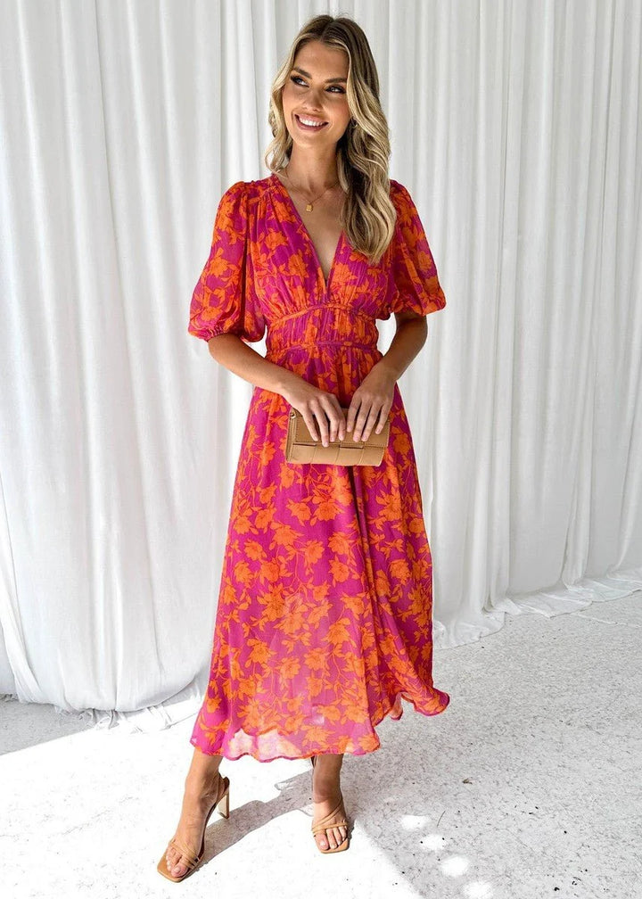 Women's midi dress featuring puff sleeves and a stylish V-neck, adorned with a vibrant floral print, perfect for autumn and winter occasions. 0