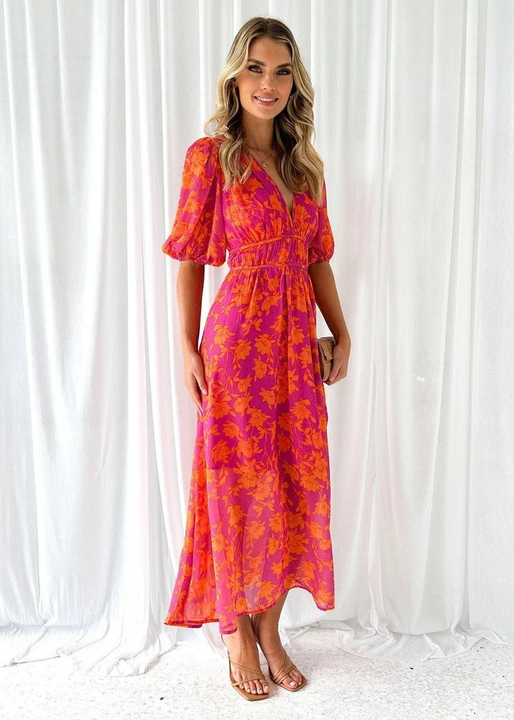 Women's midi dress featuring puff sleeves and a stylish V-neck, adorned with a vibrant floral print, perfect for autumn and winter occasions. 1