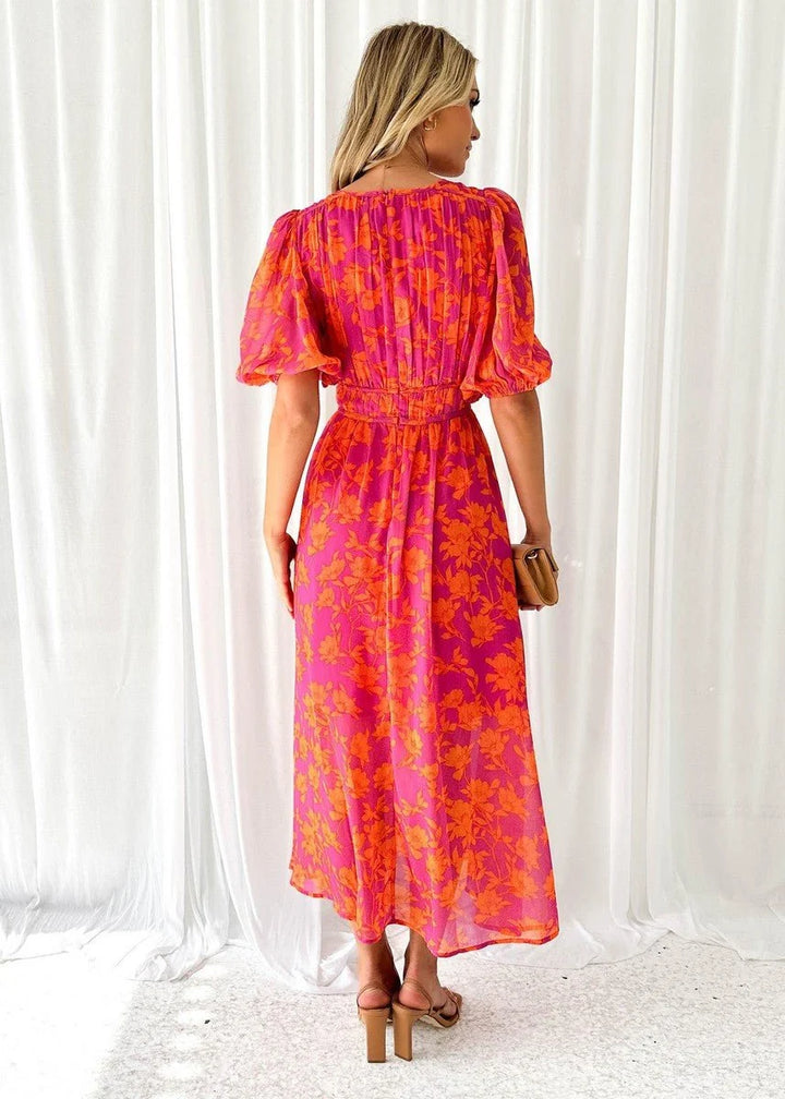 Women's midi dress featuring puff sleeves and a stylish V-neck, adorned with a vibrant floral print, perfect for autumn and winter occasions. 2