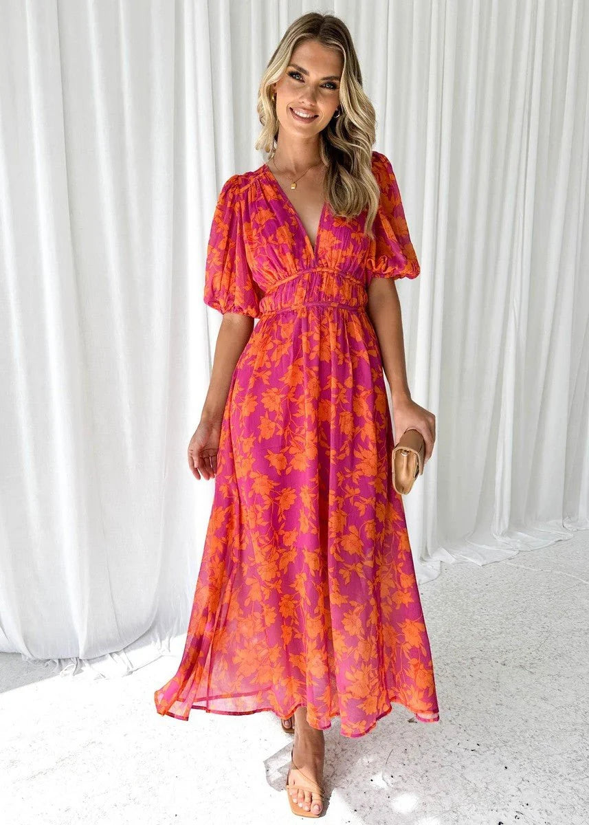 Women's midi dress featuring puff sleeves and a stylish V-neck, adorned with a vibrant floral print, perfect for autumn and winter occasions. 3