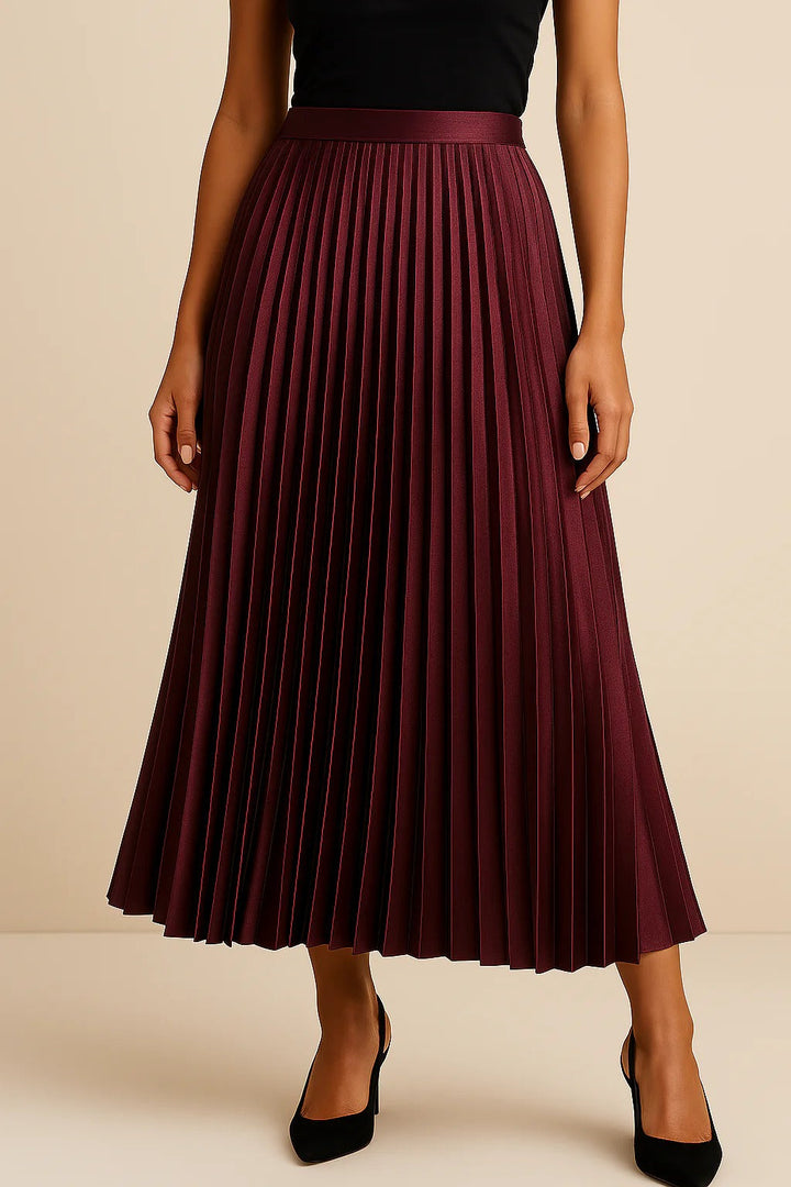 Women's black satin midi skirt featuring accordion pleats and a high waist A-line design, perfect for elegant and versatile styling. 5
