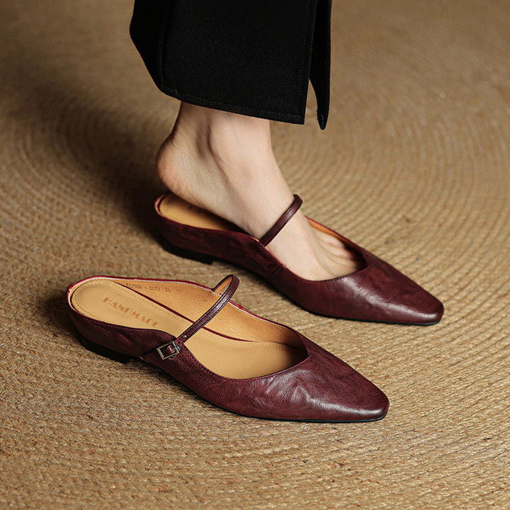 Women's mules shoes featuring a padded footbed, crafted from genuine leather, designed for both casual and formal wear with a stylish slip-on design. 7