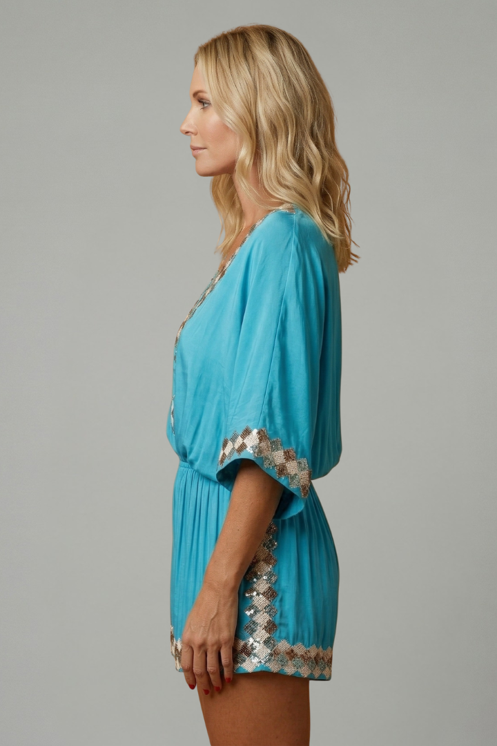 Women's sky blue playsuit featuring a smocked waist and V-neck design, lightweight fabric with elegant embroidery, perfect for summer outings. 2