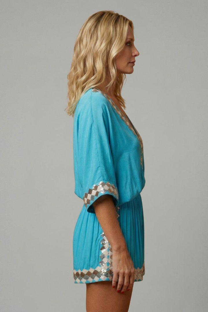 Women's sky blue playsuit featuring a smocked waist and V-neck design, lightweight fabric with elegant embroidery, perfect for summer outings. 4