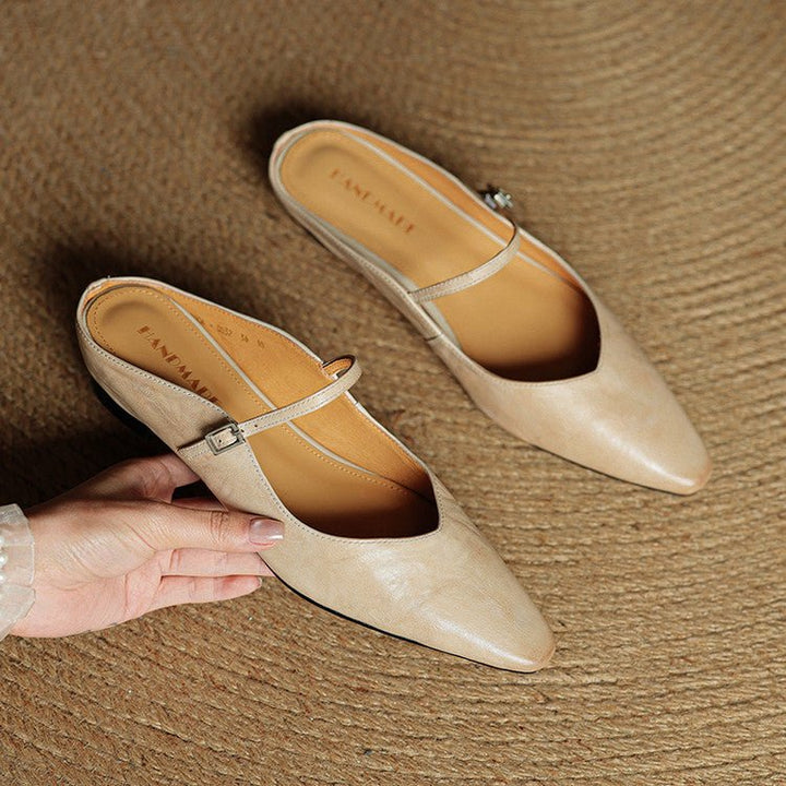 Women's black pointed-toe flats featuring a stylish buckle strap, designed for comfort as leather slip-on Mary Jane shoes, perfect for casual and formal occasions. 5
