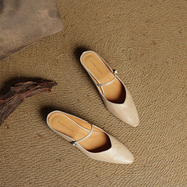 Women's black pointed-toe flats featuring a stylish buckle strap, designed for comfort as leather slip-on Mary Jane shoes, perfect for casual and formal occasions. 6