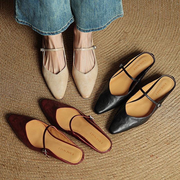 Women's black pointed-toe flats featuring a stylish buckle strap, designed for comfort as leather slip-on Mary Jane shoes, perfect for casual and formal occasions. 8