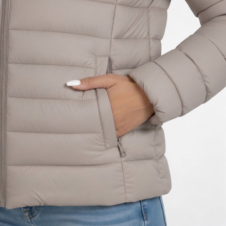 Women's quilted jacket featuring a slim fit design, lightweight construction, and casual style in a neutral tone, perfect for versatile layering. 2