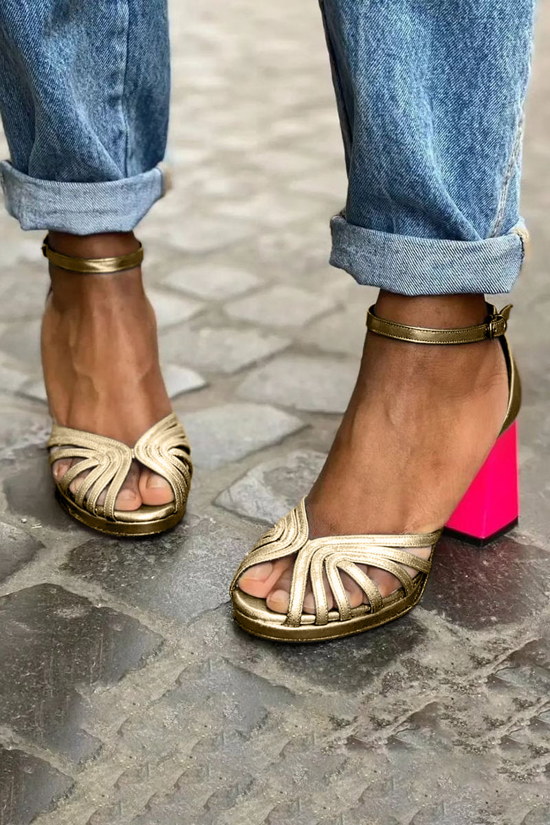Women's sandals featuring an adjustable ankle strap, open-toe design, and classic leather mid-height heels, perfect for stylish summer outings. 1