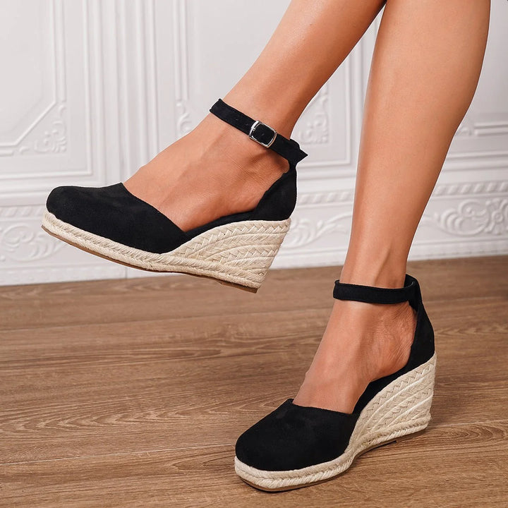 Women's sandals featuring an adjustable ankle strap and a stylish wedge heel, designed for comfort and casual summer wear. 5