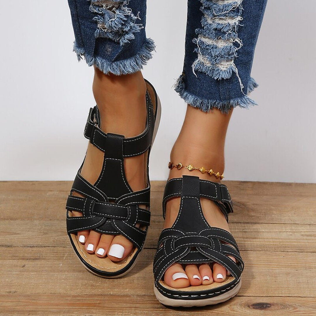 Women's sandals featuring a stylish braided strap design, adjustable fit for comfort, and orthopedic support, perfect for summer wear. 0