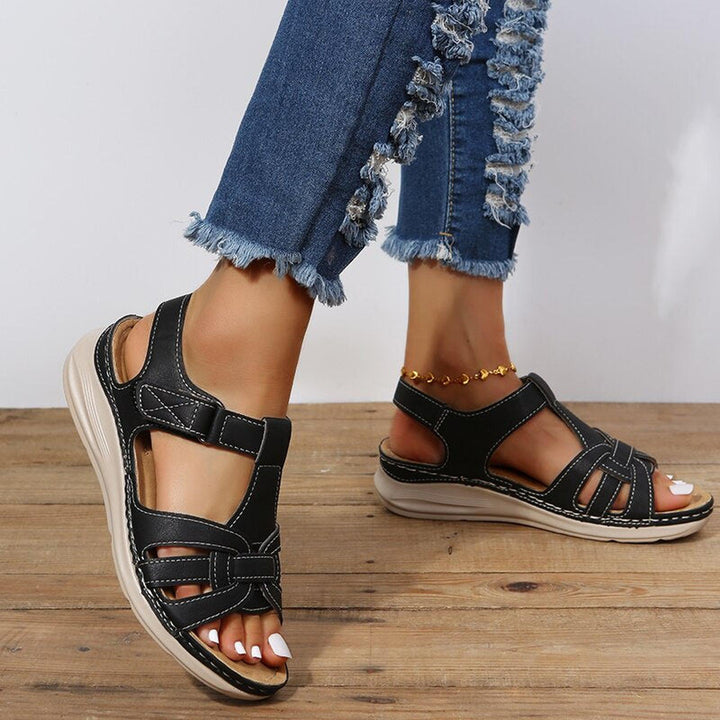 Women's sandals featuring a stylish braided strap design, adjustable fit for comfort, and orthopedic support, perfect for summer wear. 3