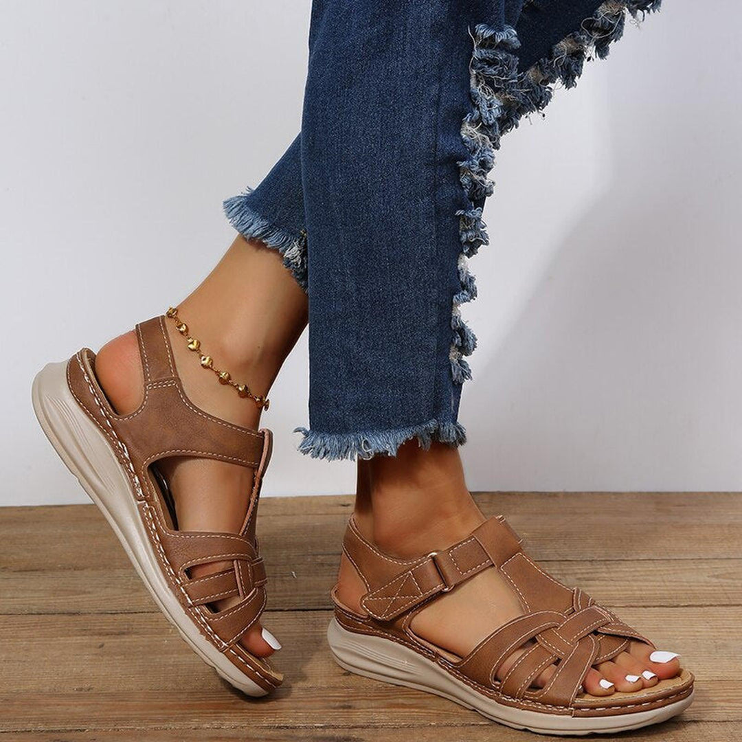 Women's sandals featuring a stylish braided strap design, adjustable fit for comfort, and orthopedic support, perfect for summer wear. 5