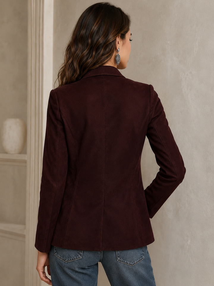 Women's suede blazer featuring a notch lapel and patch pockets, designed for a relaxed fit with a soft matte finish. 3