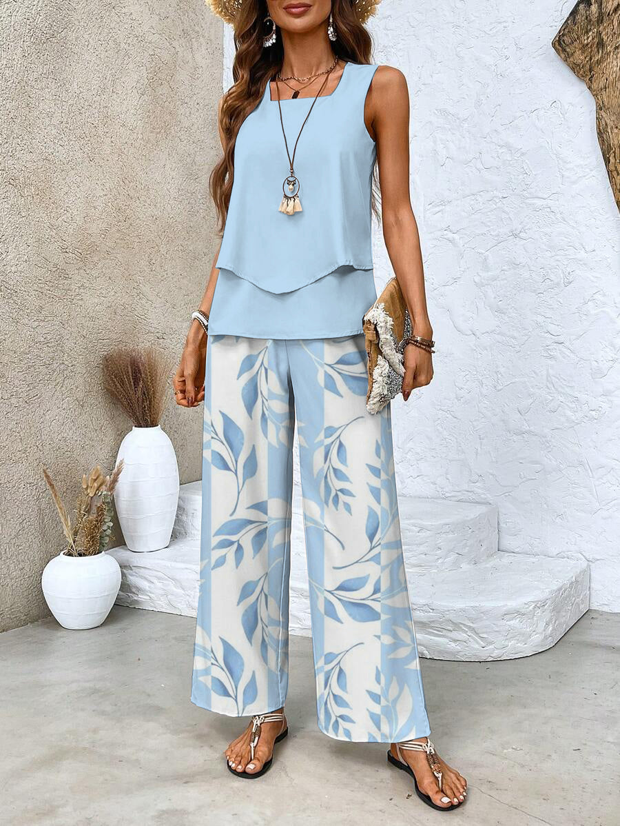 Women's summer set featuring a stylish layered top and wide-leg pants, perfect for casual outings. Lightweight and breathable fabric ideal for warm weather. 0