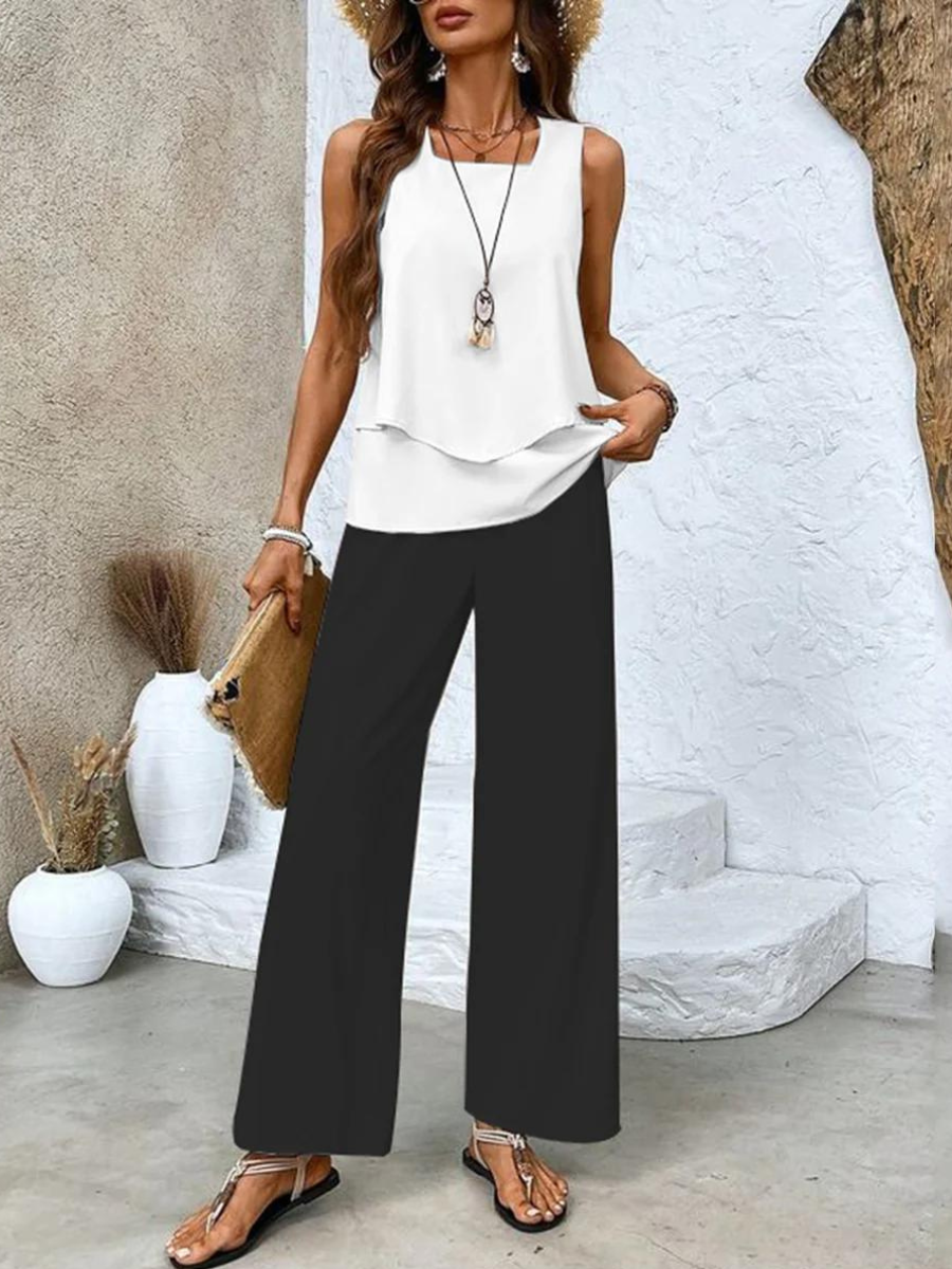 Women's summer set featuring a stylish layered top and wide-leg pants, perfect for casual outings. Lightweight and breathable fabric ideal for warm weather. 3