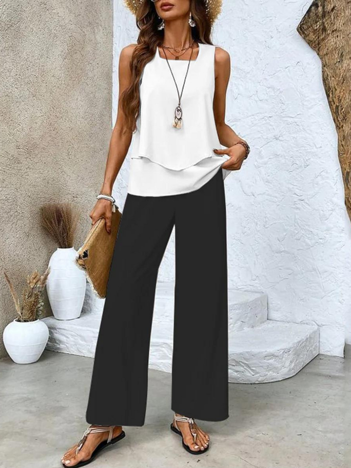 Women's summer set featuring a stylish layered top and wide-leg pants, perfect for casual outings. Lightweight and breathable fabric ideal for warm weather. 3