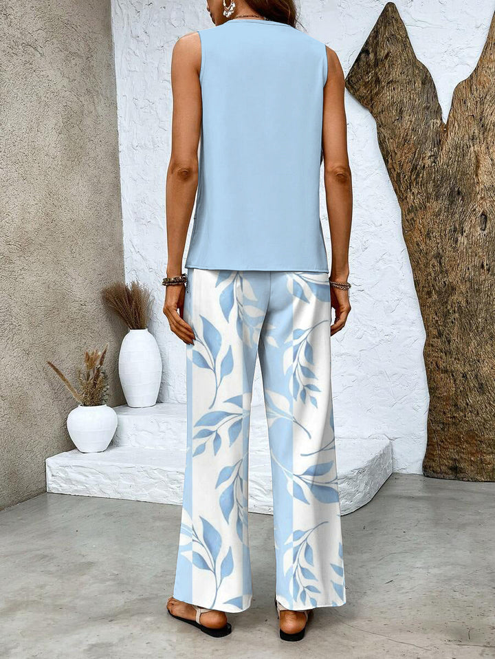 Women's summer set featuring a stylish layered top and wide-leg pants, perfect for casual outings. Lightweight and breathable fabric ideal for warm weather. 5