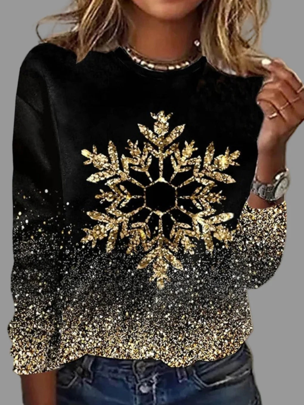Women's cozy knit sweater featuring elegant golden snowflakes, designed in a relaxed fit for a stylish and festive look. 0