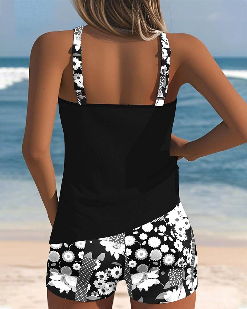 Women's tankini swimwear set featuring a stylish floral print and comfortable shorts, perfect for beach outings and poolside relaxation. 4