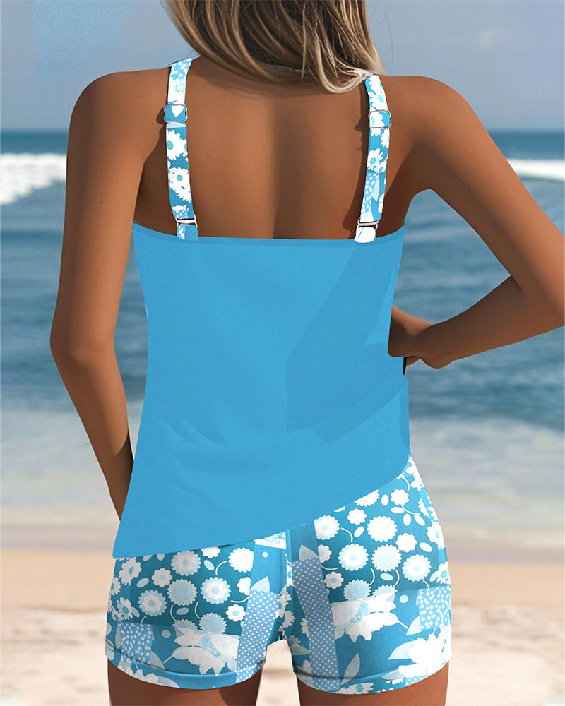 Women's tankini swimwear set featuring a stylish floral print and comfortable shorts, perfect for beach outings and poolside relaxation. 5