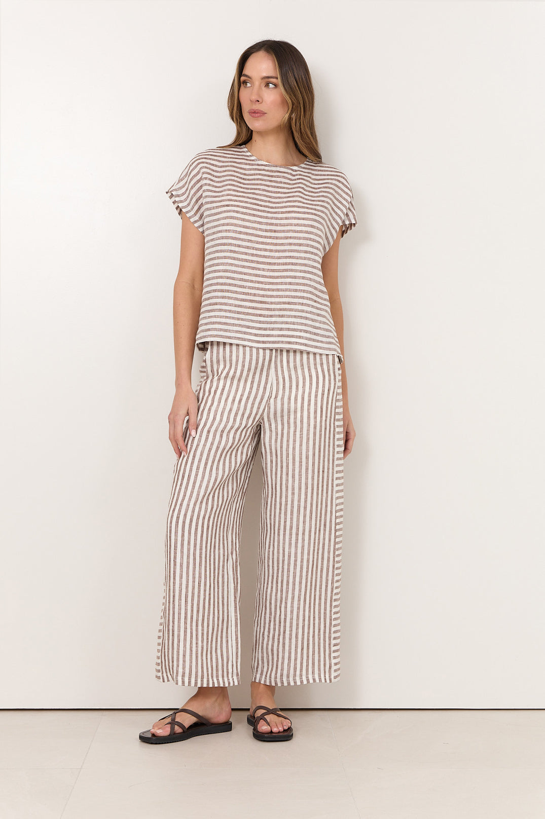 Women's relaxed fit top featuring a stylish chocolate and white stripe design, made from 100% breathable linen. 2