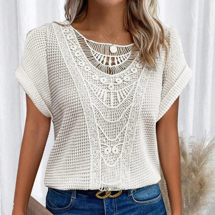 Women's relaxed fit cotton blend top featuring a round neck and delicate lace trim, perfect for everyday wear. 7