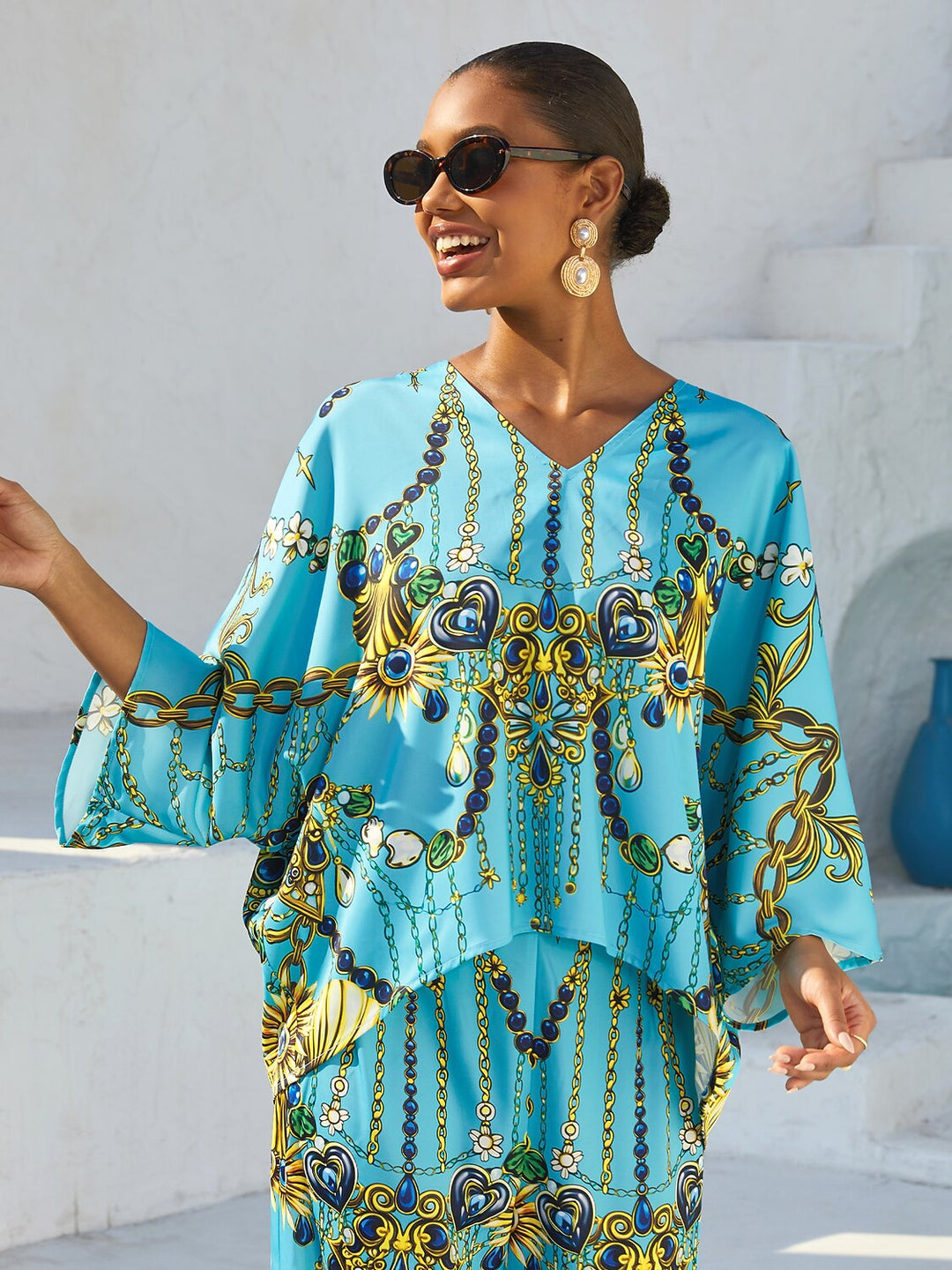 Women's Mediterranean Blue V-Neck Top with Batwing Sleeves in Silky Satin featuring a stylish jewelry print. 0