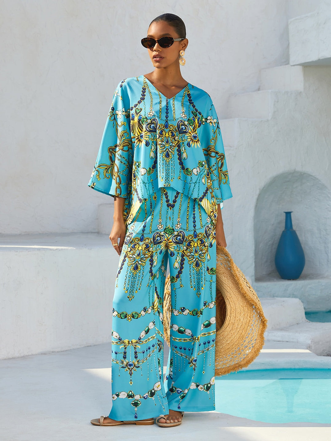 Women's Mediterranean Blue V-Neck Top with Batwing Sleeves in Silky Satin featuring a stylish jewelry print. 1