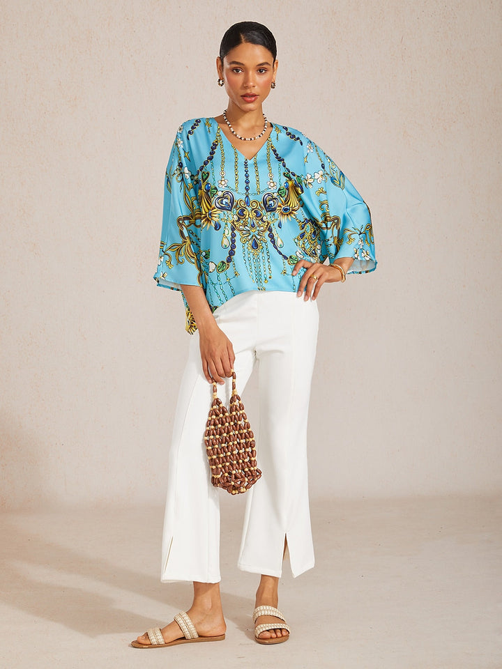 Women's Mediterranean Blue V-Neck Top with Batwing Sleeves in Silky Satin featuring a stylish jewelry print. 3