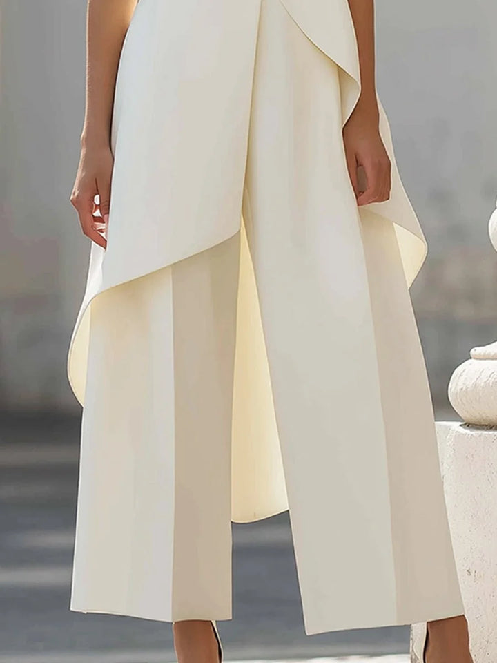 Women's two piece set featuring an asymmetrical high neck top and wide-leg trousers, designed for an elegant and modern look, perfect for any occasion. 2